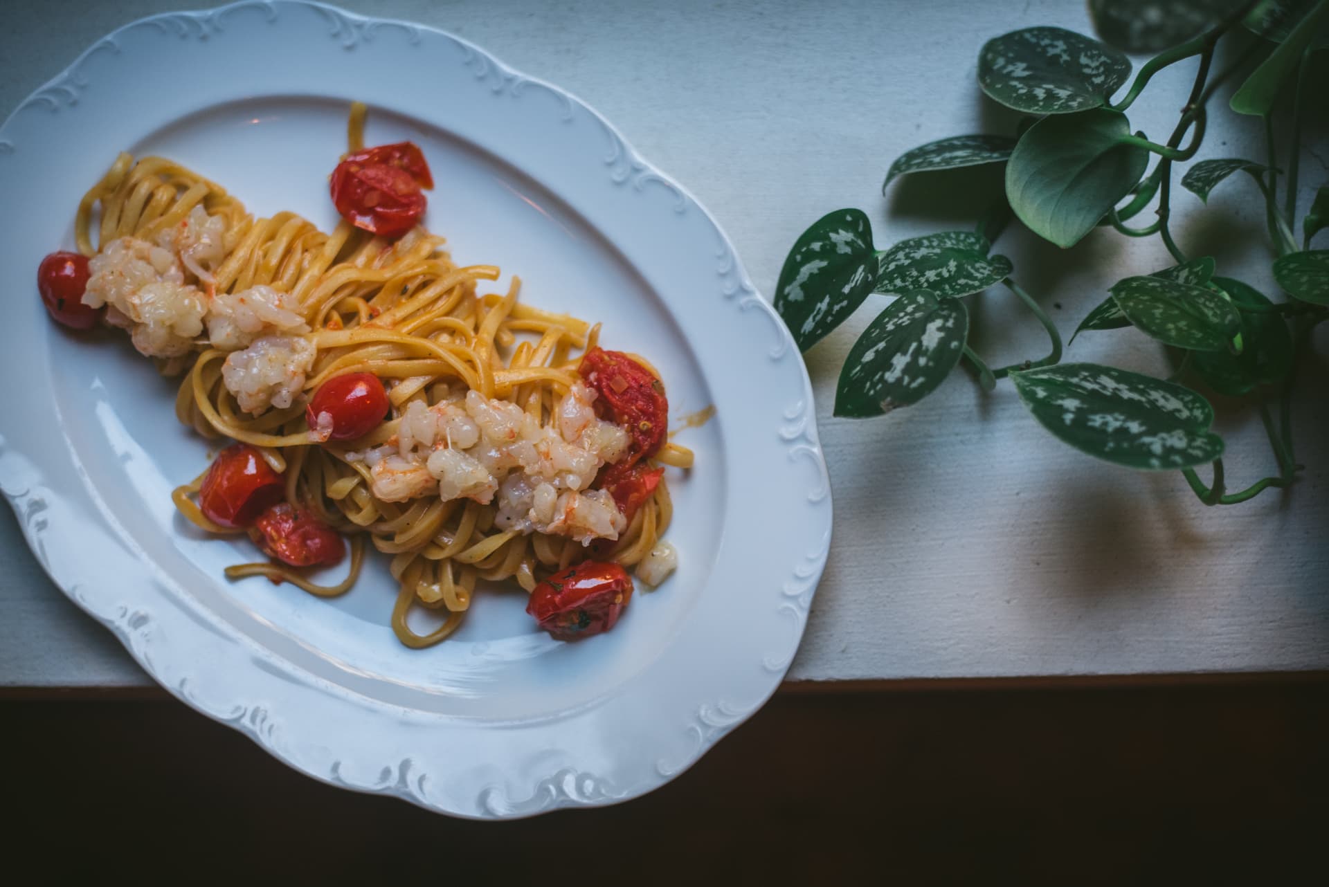 A plate of pasta with prawns and cherry tomatoes, served at Lupaia Osteria